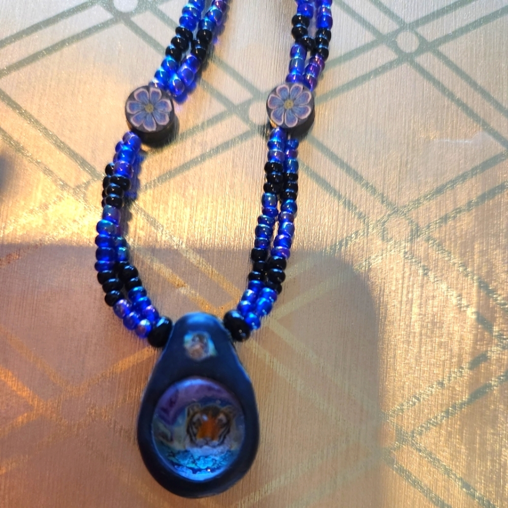 Tiger bubble/ polymer clay pendant blue beaded necklace.